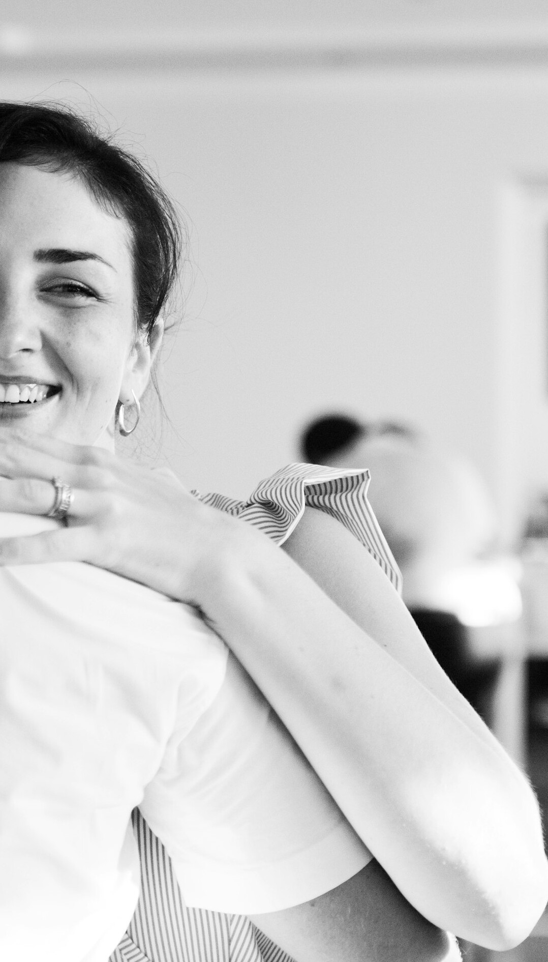 Colleagues in a corporate training session smiling