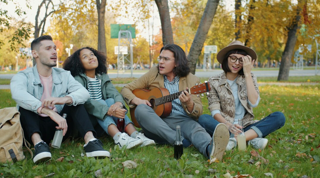 Group of friends laughing together outdoors